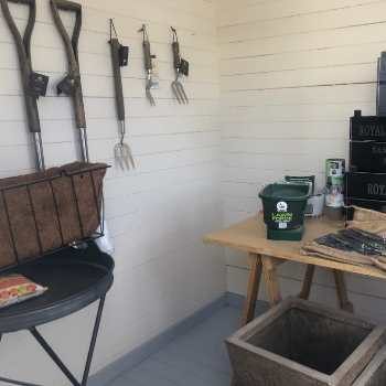 wooden garden shed with tools